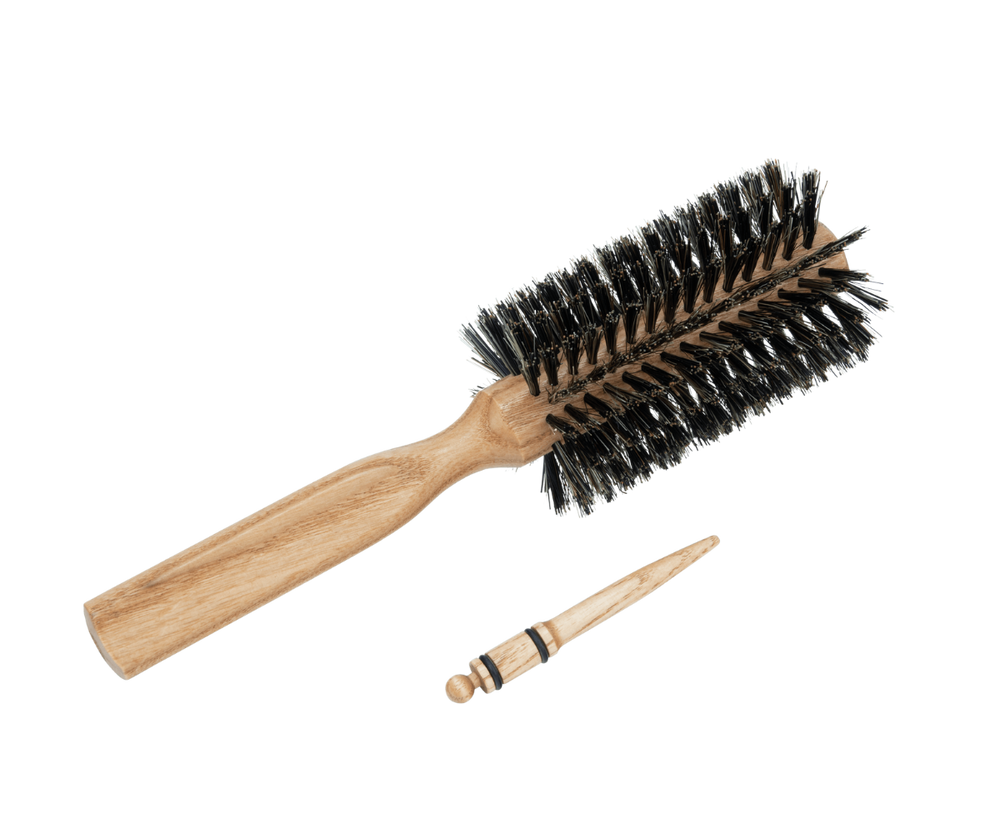 Hair dryer brush with natural bristles with pin for sectioning the hair