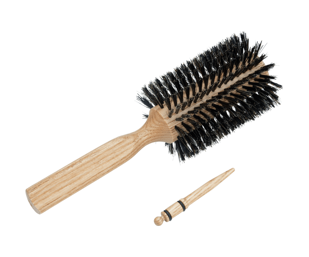
                  
                    Hair dryer brush with natural bristles with pin for sectioning the hair
                  
                